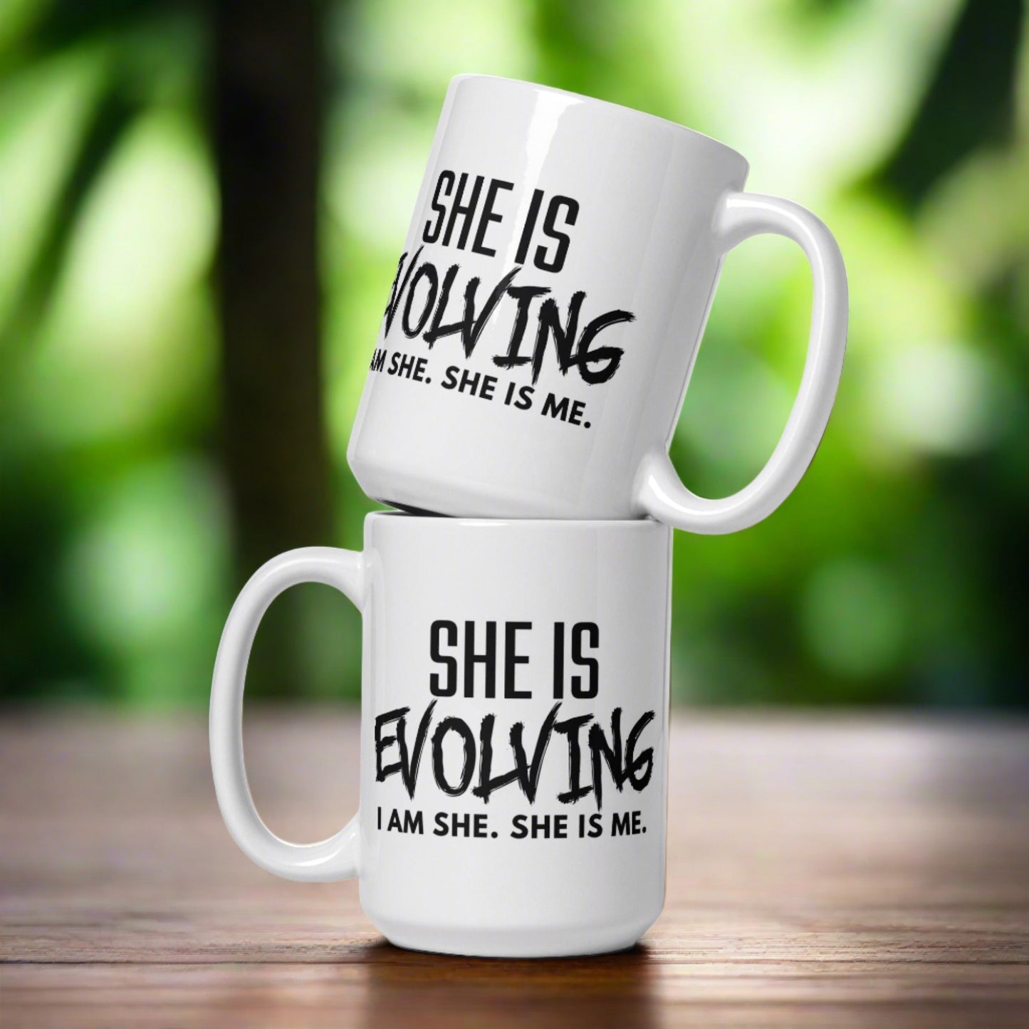 SHE IS EVOLVING TEA MUG