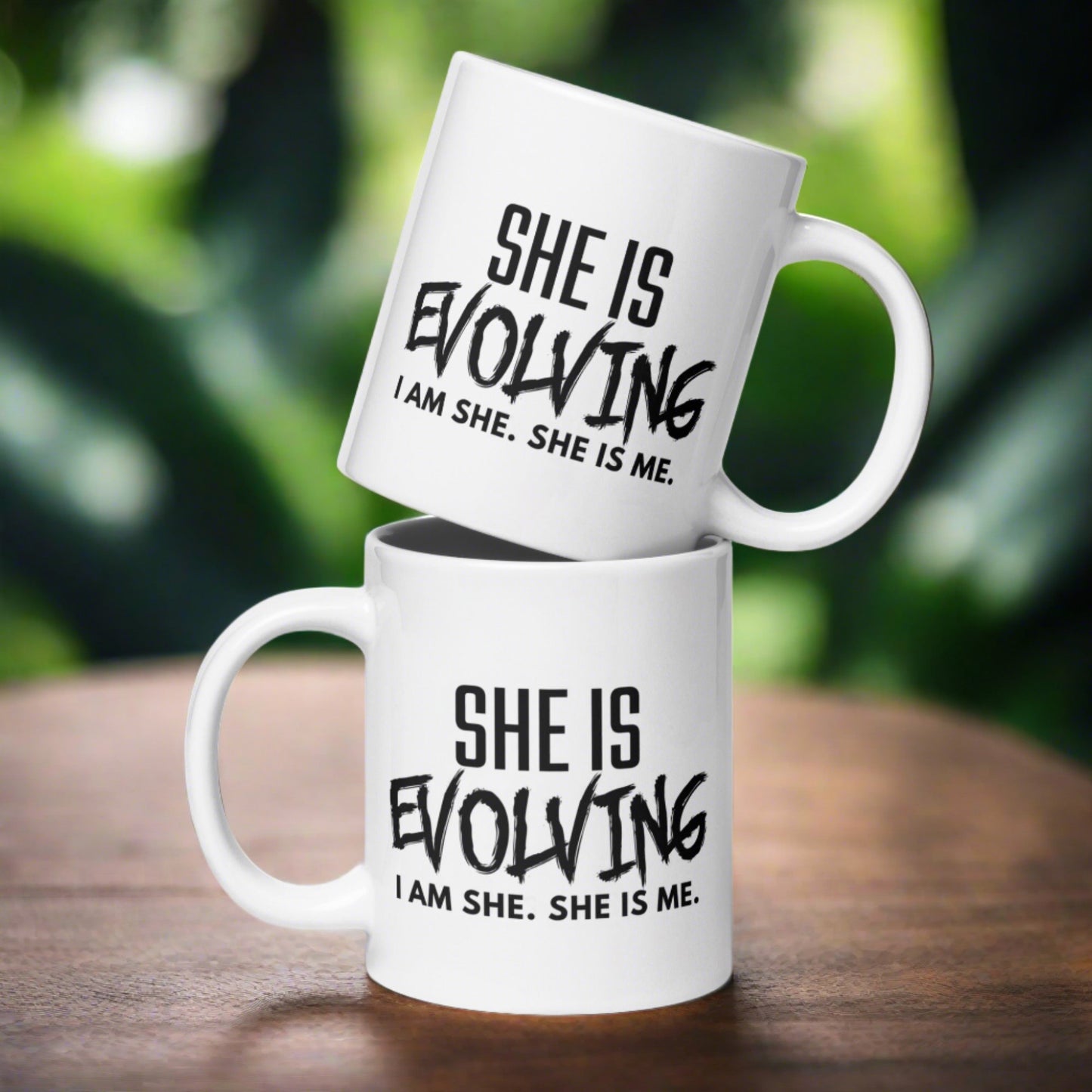 SHE IS EVOLVING TEA MUG